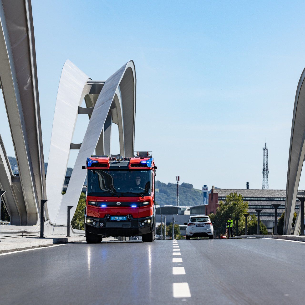 Front view of the Rosenbauer RT on a bridge in an urban environment.