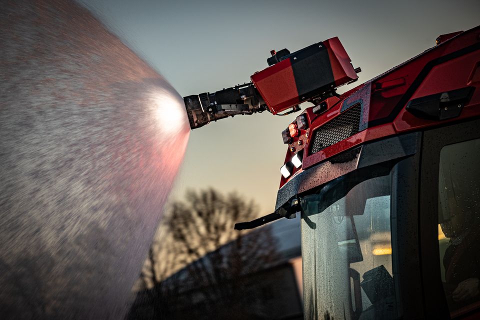 RT: Detail water cannon in action Close-up of the water cannon mounted on the front roof of the RT in action.